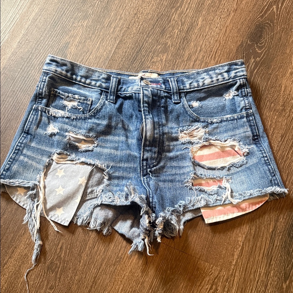 Hollister Distressed Blue Denim Shorts with Flag Patch Detail